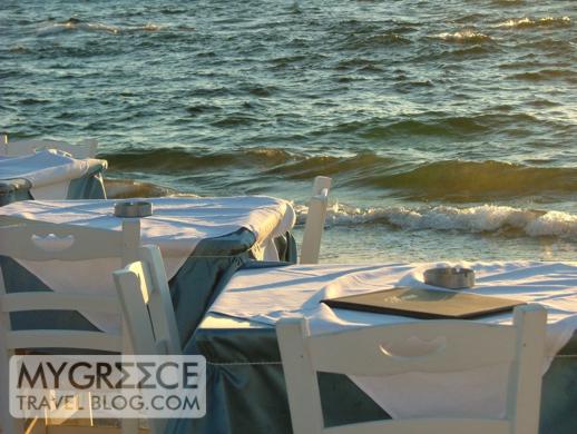 Tables next to the sea at a Little Venice taverna