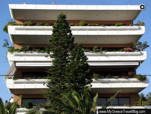 Plant and flower-filled terraces on a midrise residential building in Glyfada