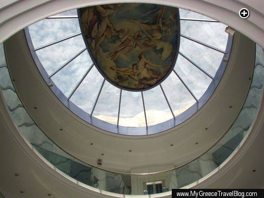 Artwork adorns the ceiling of a shopping enter atrium in Glyfada