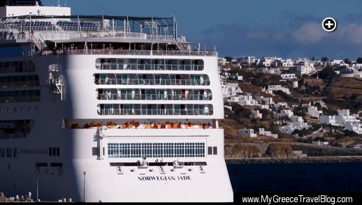Part of Mykonos Town is visible on the starboard side of the Norwegian Jade cruise ship