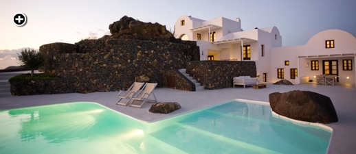 View toward the villas from the infinity pool at Aenaon Villas in Santorini