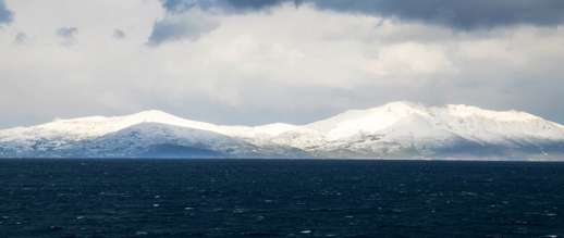 Achim Eckhardt photo of snow on Tinos, as seen from nearby Mykonos island