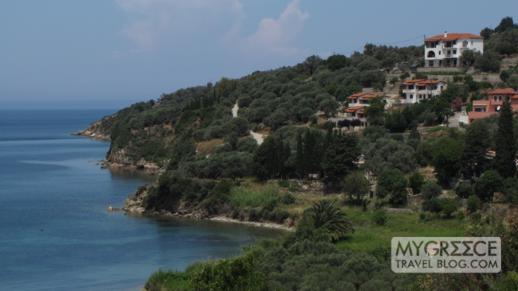 Houses on a hillside above the coast in Kalami