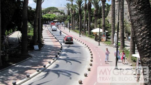 the palm tree lined street outside the castle in Kos Town