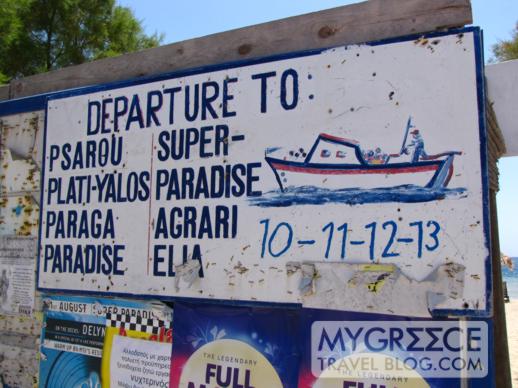 Ornos beach shuttle boat sign