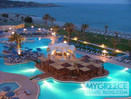 Rodos Palladium hotel swimming pool at dusk 