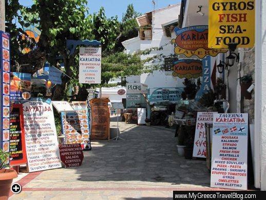 Signs along a row of restaurants in Kokkari