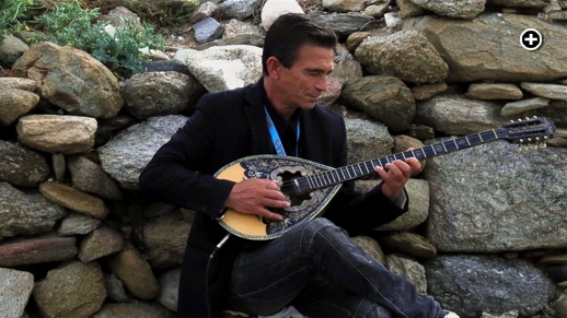 A musician plays the bouzouki in the Kastro area of Mykonos Town