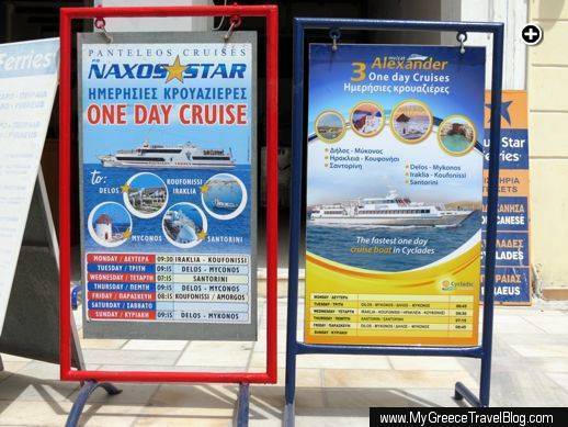 Sandwich board signs advertising Delos and other island tours from Naxos