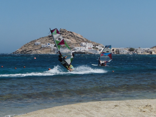 windsurfers challenge strong winds in kalafatis bay at Mykonos