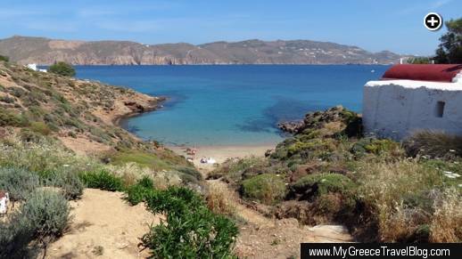 A picturesque cove and sandy beach on Panormos Bay below Kiki's Taverna at Agios Sostis