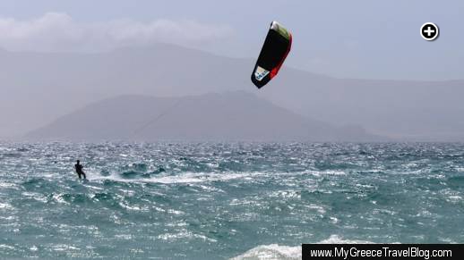 A kitesurfer skims across the choppy sea off Agios Prokopios beach at Naxos on May 23 2013