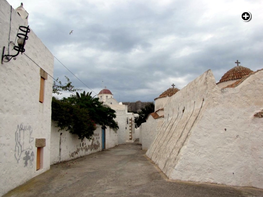 Stormclouds pass above churches in Chora village on Patmos
