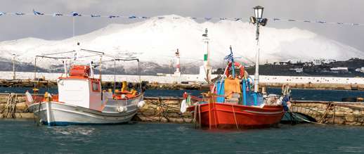 Achim Eckhardt photo of snowy Tinos as seen from a harbour on Mykonos