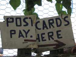 postcards pay here sign