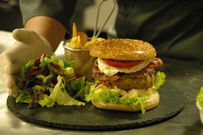 a gourmet burger at Cayenne Mykonos