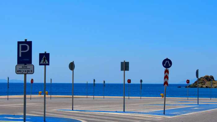 signs at the Tinos port