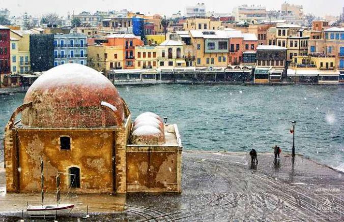 snow falling at the Chania Crete harbourfront
