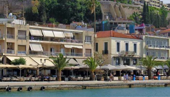 buildings and palm trees along the Nafplio waterfront