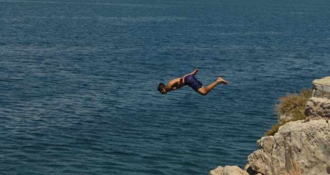 Greece, Peloponnese, Argolida, Nafplio, Arvanitia promenade, coast, cliff, diving, cliff diving