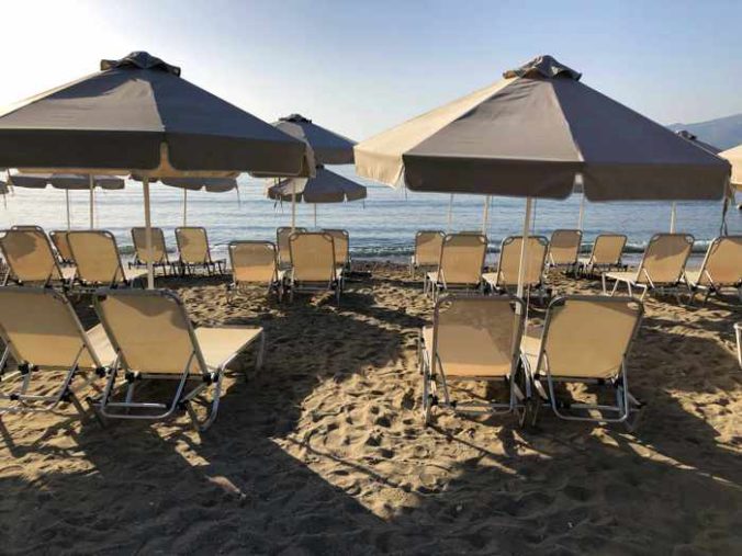 Greece, Greek island, Saronic island, Poros, Poros Greece, Poros island, beach, Kanali beach Poros, Kanali beach, lounge chairs, umbrellas, organized beach