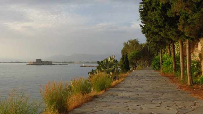 Greece, Peloponnese, Argolida, Nafplio, Arvanitia promenade, walkway, path, coast, seaside,Bourtzi castle, Argolic Gulf,