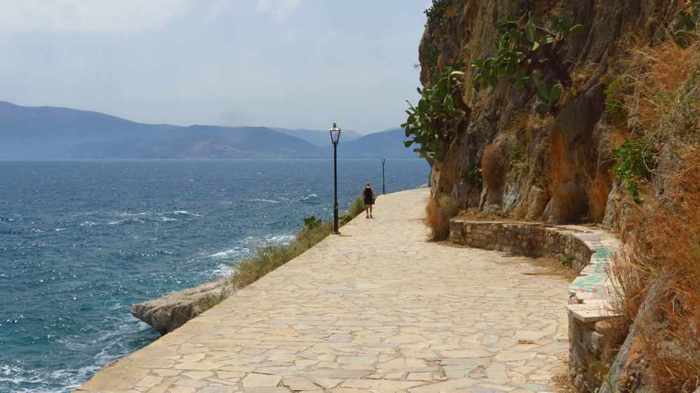 Greece, Peloponnese, Argolida, Nafplio, Arvanitia promenade, path, walkway, coast, tunnel, passageway