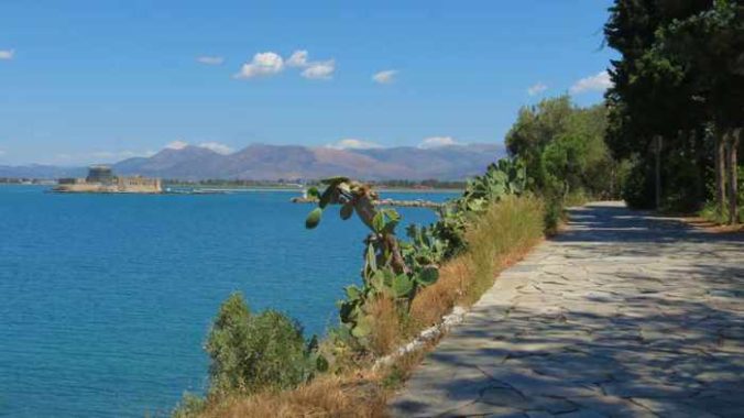 Greece, Peloponnese, Argolida, Nafplio, Arvanitia promenade, walkway, path, coast, seaside,Bourtzi castle, Argolic Gulf,