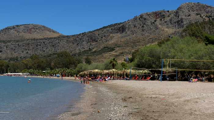 Greece, Peloponnese, Nafplio,Karathona, Karathona beach, beach, bay, seaside, shore, coast, sunbeds, loungers, beach umbrellas, 