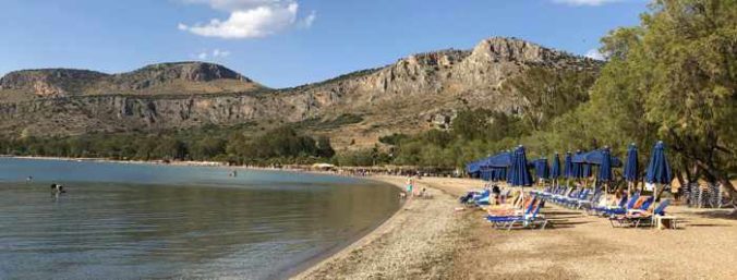 Greece, Peloponnese, Nafplio,Karathona, Karathona beach, beach, bay, seaside, shore, coast, sunbeds, loungers, beach umbrellas,