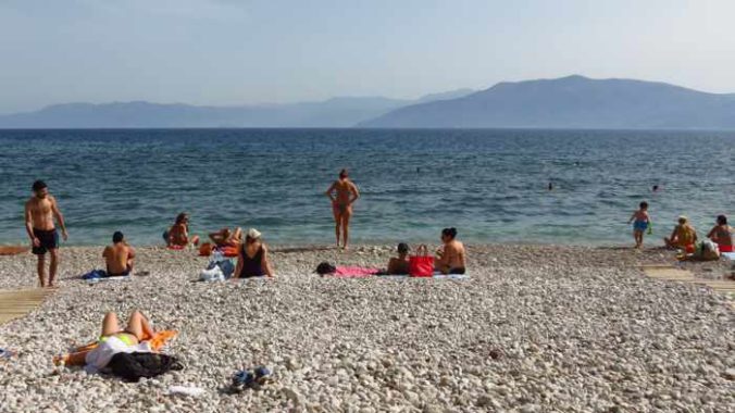 Greece, Peloponnese, Nafplio, Arvanitia, Arvanitia beach, beach, Nafplio beach, seaside, coast, sunbathers, swimmers, Argolic Gulf, sea, water