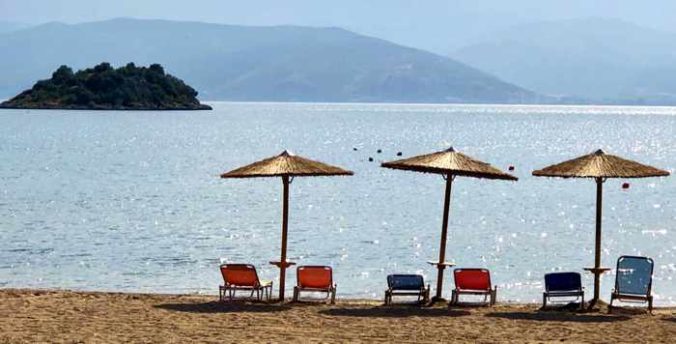 Greece, Peloponnese, Nafplio,Karathona, Karathona beach, beach, bay, seaside, shore, coast, sunbeds, loungers, beach umbrellas,