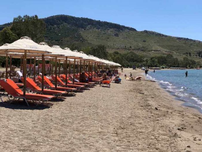 Greece, Peloponnese, Nafplio,Karathona, Karathona beach, beach, bay, seaside, shore, coast, sunbeds, loungers, beach umbrellas,