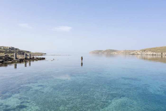 From the NEON page on Instagram a photo of an Antony Gormley sculpture on the coast of Delos island Greece