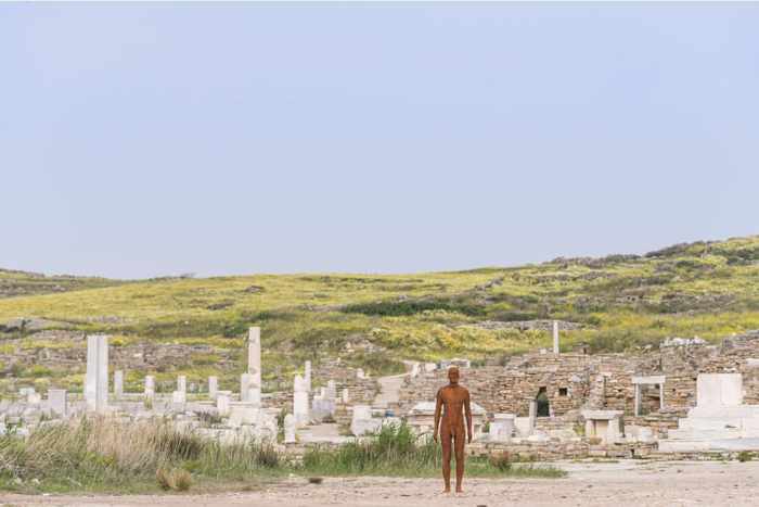 From the NEON page on Instagram a photo of an Antony Gormley sculpture positioned in the ruins on Delos island Greece