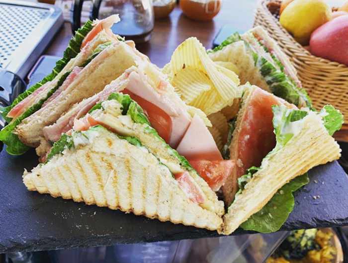 Chill Out Lounge Cafe Bar Mykonos social media photo of its king size club sandwich