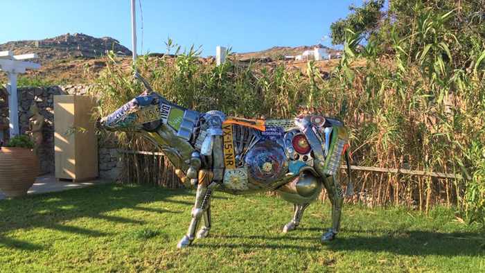 Contemporary art sculpture in the garden at Blue Fusion Art Restaurant Mykonos