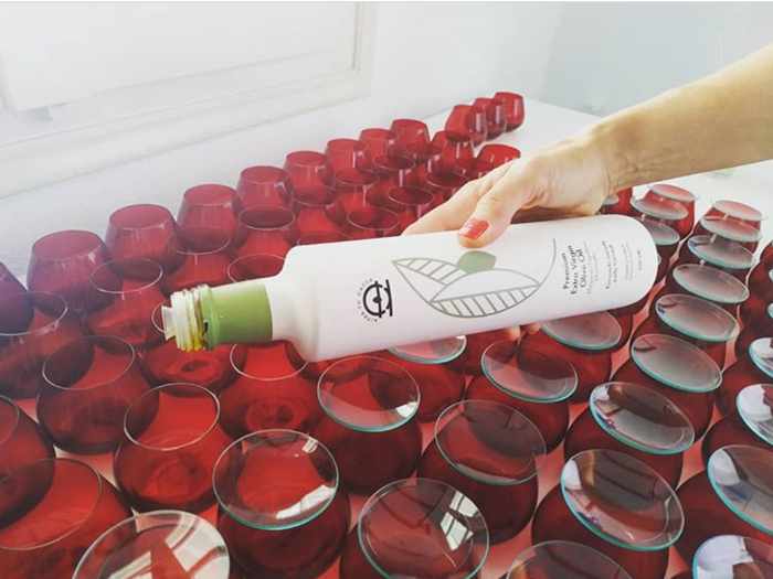 Mykonos Olive Oil Tasting Facebook page photo of tasting glasses being prepared