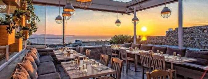 Olive Tree Mykonos sunset view dining terrace photo from the restaurant page on Facebook
