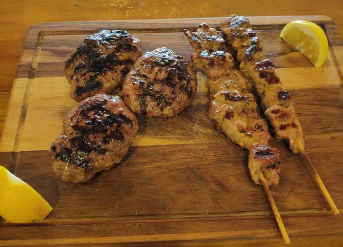 Taverna Kandavlos Mykonos social media photo of a platter of grilled meat and skewers