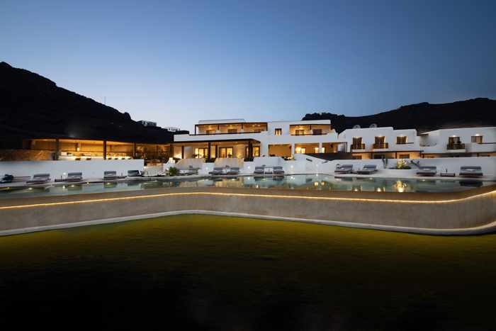 Aegon Mykonos Facebook page photo showing the hotel and pool at twilight