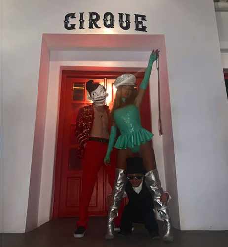 Entertainment acts pose in front of the entrance to Cirque Mykonos nightclub