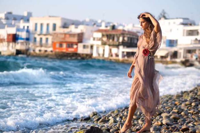 Model wears a Dassios dress at the Little Venice seafront of Mykonos Town