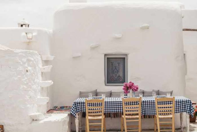 Rizes Folklore Farmstead Mykonos website photo of a table at its traditional restaurant