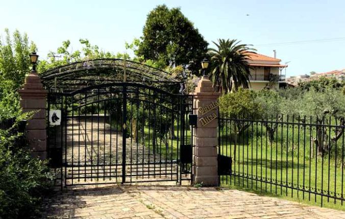 the gated entrance to a private estate at Molyvos on Lesvos island