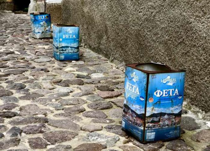 old feta cheese containers in a lane in Molyvos on Lesvos island