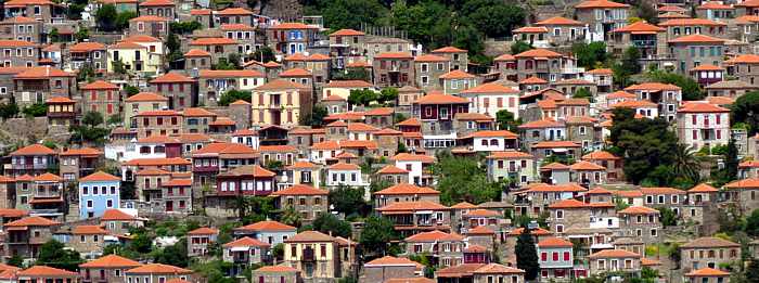 buildings cling to the steep hills below the Castle of Molyvos on Lesvos