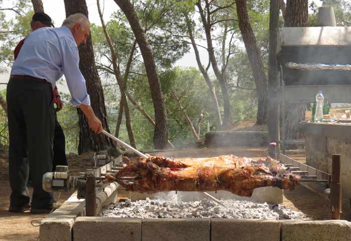 Roasting lamb on the spit at Delfinia Hotel on Lesvos