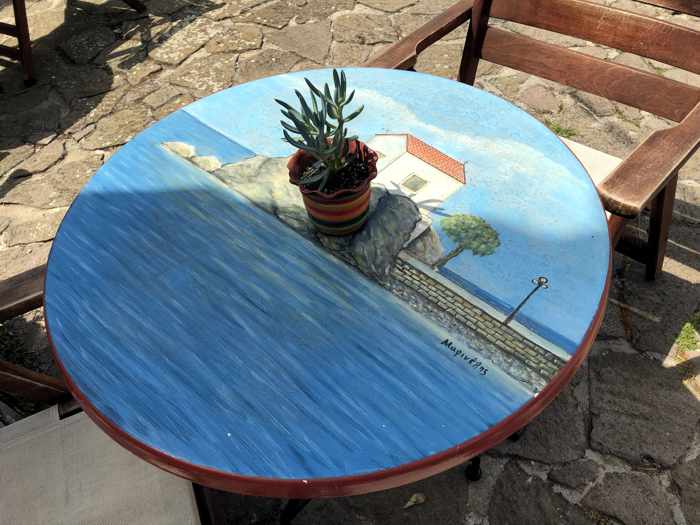 Cafe table painting of Mermaid Madonna Church