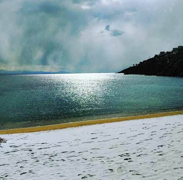 Snow on Psarou beach Mykonos